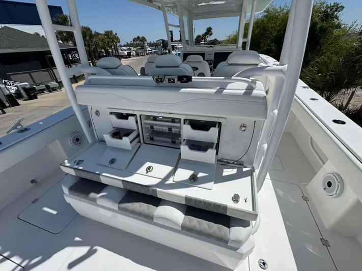  Yacht Photos Pics 2022 Invincible 46 Catamaran interior with seating and storage compartments.