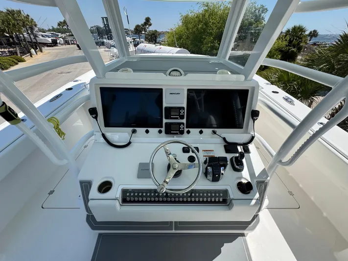 Yacht Photos Pics 2022 Invincible 46 Catamaran helm with dual screens and steering wheel.