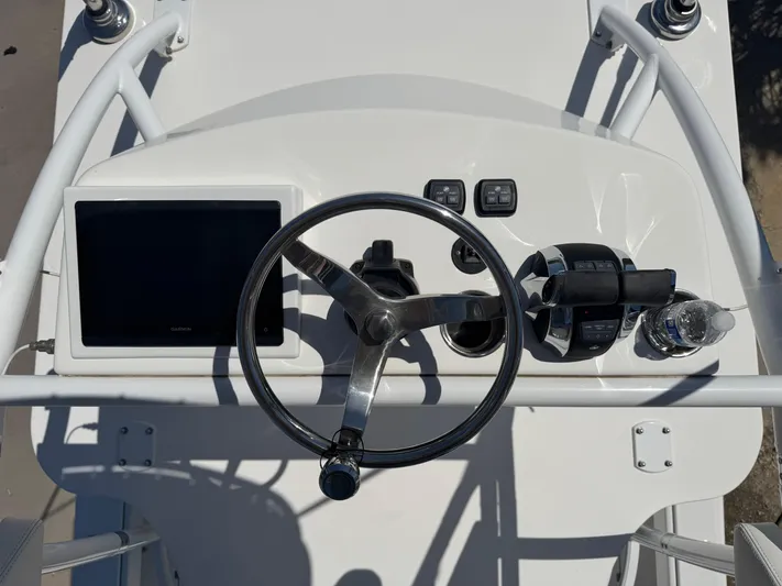  Yacht Photos Pics Helm of 2022 Invincible 46 Catamaran with steering wheel and navigation controls.