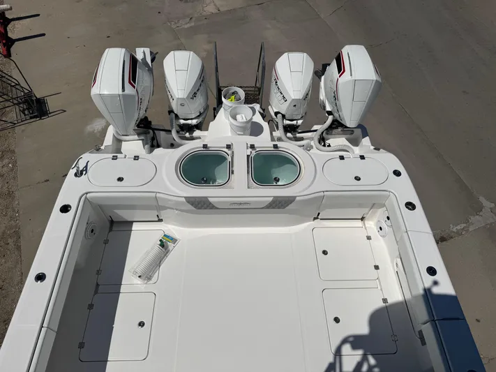  Yacht Photos Pics 2022 Invincible 46 Catamaran with four engines and dual livewells, viewed from above.