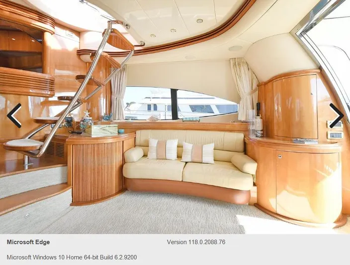  Yacht Photos Pics Luxurious interior of 2005 Azimut 68E yacht with beige sofa and wooden finishes.