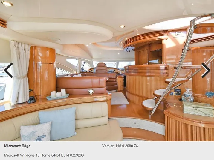  Yacht Photos Pics Luxurious interior of a 2005 Azimut 68E yacht with elegant wood finishes and modern furnishings.