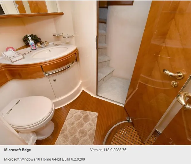  Yacht Photos Pics Luxurious bathroom in a 2005 Azimut 68E yacht with wooden accents and modern fixtures.