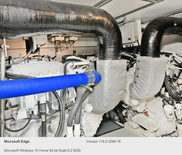  Yacht Photos Pics Engine room of a 2005 Azimut 68E yacht with visible machinery and pipes.