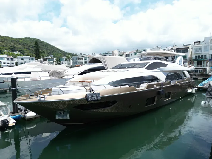  Yacht Photos Pics Luxury 2016 Azimut 100 Grande yacht docked in marina, surrounded by other boats.