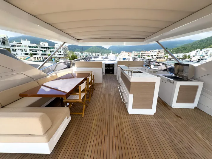  Yacht Photos Pics Luxurious 2016 Azimut 100 Grande yacht deck with seating and dining area.