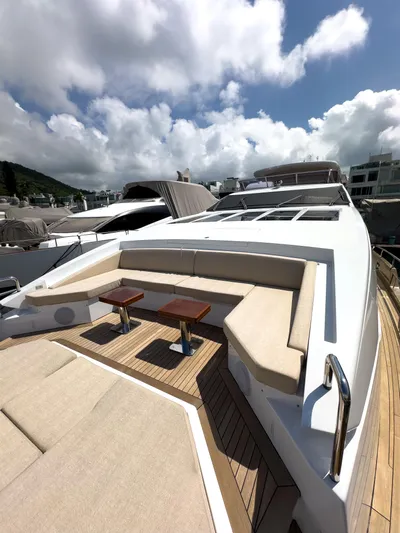  Yacht Photos Pics Luxurious 2016 Azimut 100 Grande yacht with spacious deck seating under a cloudy sky.