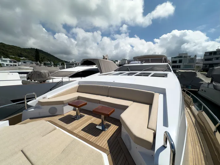  Yacht Photos Pics Luxurious 2016 Azimut 100 Grande yacht with spacious deck seating under a cloudy sky.