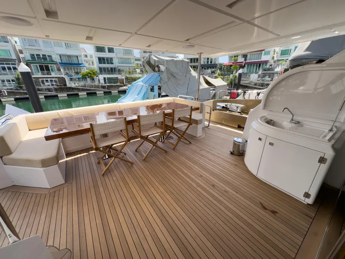  Yacht Photos Pics Luxurious deck of 2016 Azimut 100 Grande yacht with seating and kitchenette.