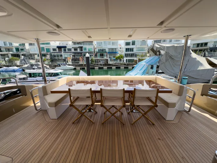  Yacht Photos Pics Luxurious 2016 Azimut 100 Grande yacht deck with elegant seating and marina view.