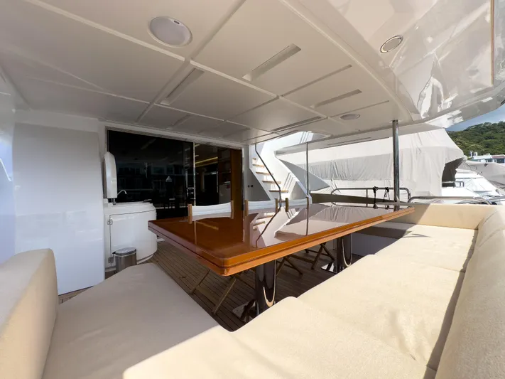  Yacht Photos Pics Luxurious 2016 Azimut 100 Grande yacht deck with elegant seating and dining area.