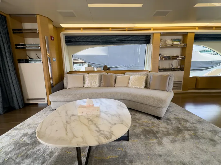  Yacht Photos Pics Luxurious interior of 2016 Azimut 100 Grande yacht with elegant sofa and marble table.