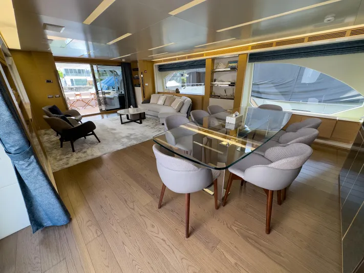  Yacht Photos Pics Luxurious interior of 2016 Azimut 100 Grande yacht with elegant dining and seating area.