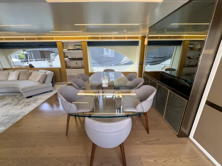  Yacht Photos Pics Luxurious interior of 2016 Azimut 100 Grande yacht with modern dining area and seating.