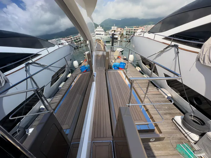  Yacht Photos Pics Azimut 100 Grande yacht deck, 2016 model, docked at marina with clear skies.