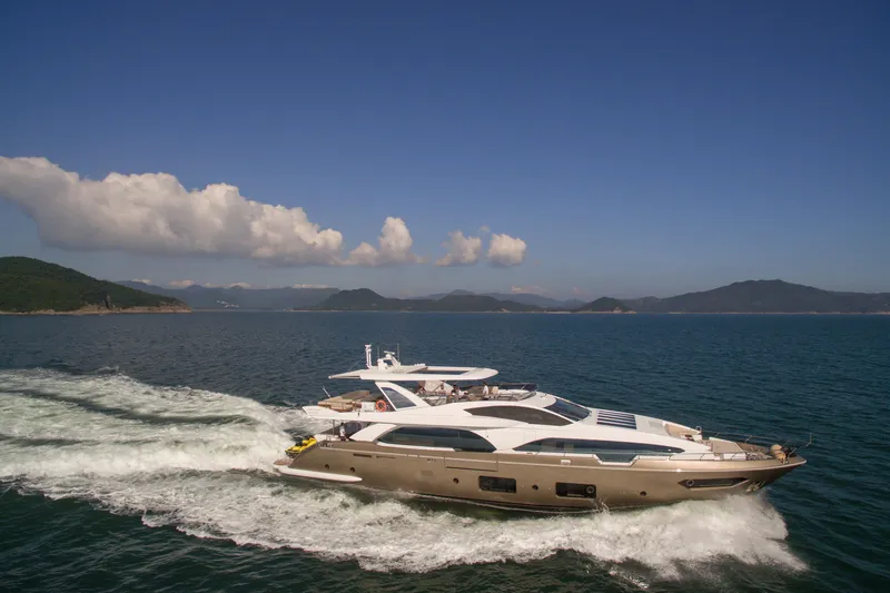  Yacht Photos Pics 2016 Azimut 100 Grande yacht cruising on open sea under clear blue sky.