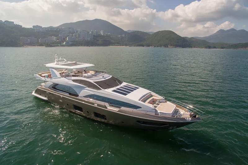  Yacht Photos Pics Luxurious 2016 Azimut 100 Grande yacht cruising on serene waters with scenic mountain backdrop.