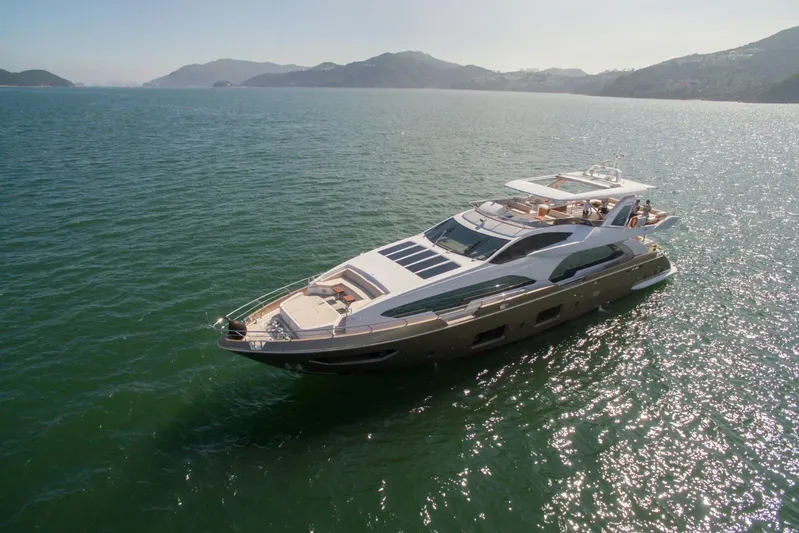  Yacht Photos Pics Luxurious 2016 Azimut 100 Grande yacht cruising on serene waters.