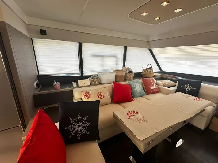  Yacht Photos Pics Luxurious interior of 2022 Fountaine Pajot MY5 yacht with stylish cushions and decor.