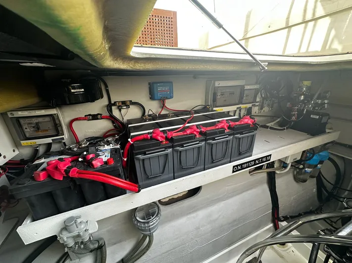  Yacht Photos Pics Electrical system of 2022 Fountaine Pajot MY5 yacht, featuring batteries and wiring.