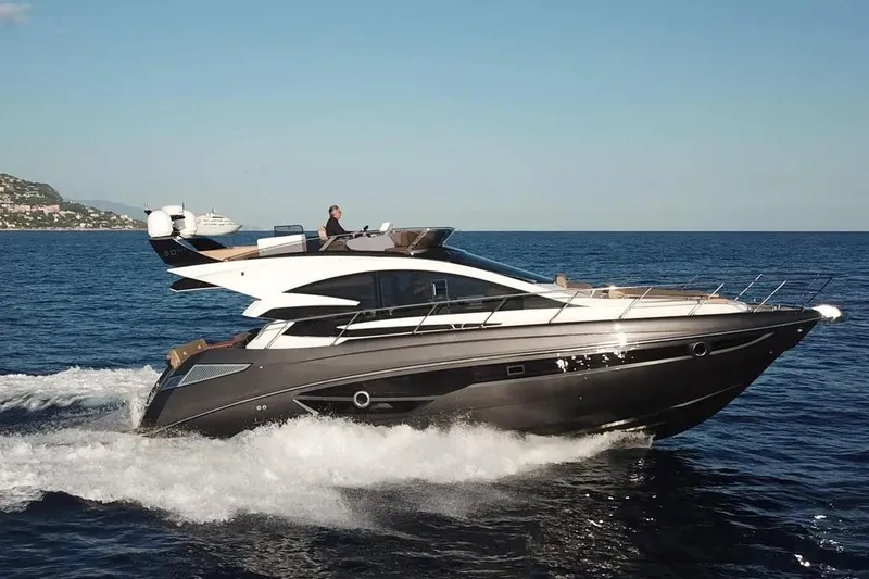  Yacht Photos Pics Luxury Cobrey 52 FLY yacht cruising on open sea, 2025 model.