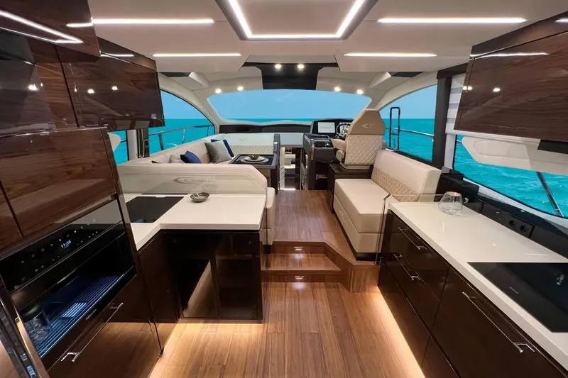  Yacht Photos Pics Luxurious interior of 2025 Cobrey 52 FLY yacht with modern design and ocean view.