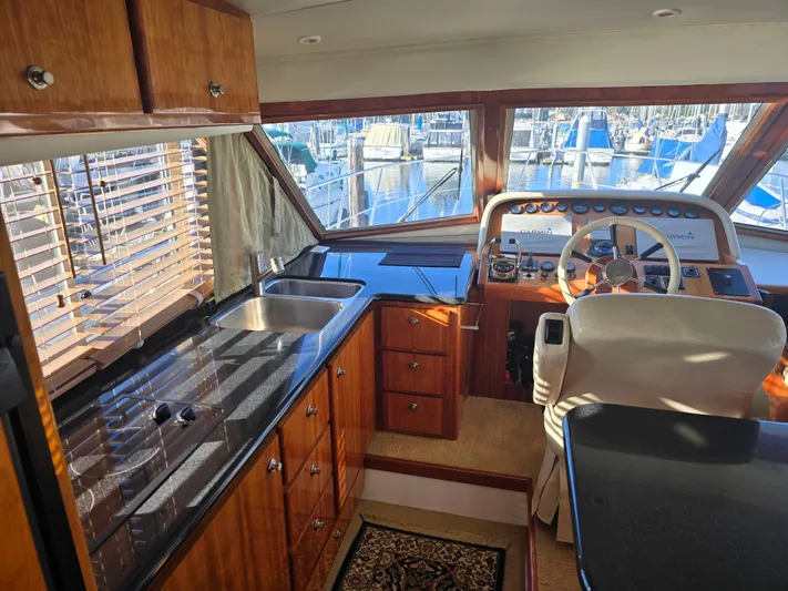 Third Wish Yacht Photos Pics Interior of a 2005 Navigator 44C yacht with helm and kitchen.