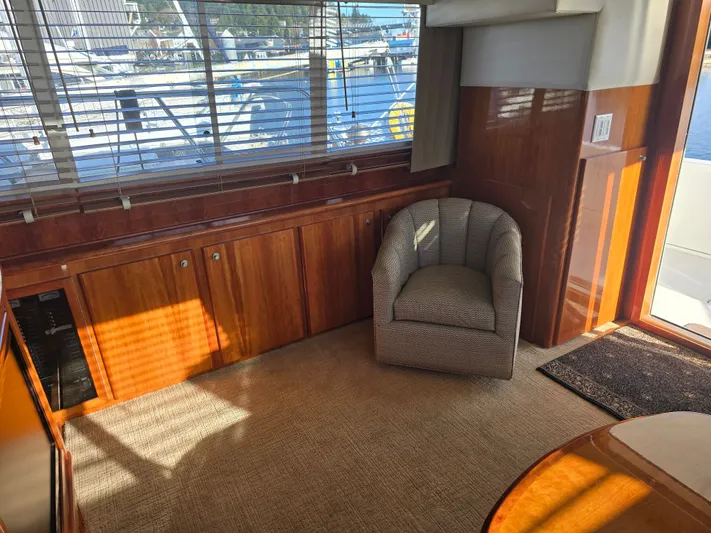Third Wish Yacht Photos Pics Interior of a 2005 Navigator 44C yacht with chair and wooden furnishings.