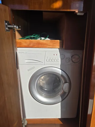 Third Wish Yacht Photos Pics Washing machine in wooden cabinet on Navigator 44C, year 2005.