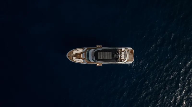 Venus Yacht Photos Pics Aerial view of 2013 Monte Carlo Yachts 86'7'' luxury yacht on open sea.