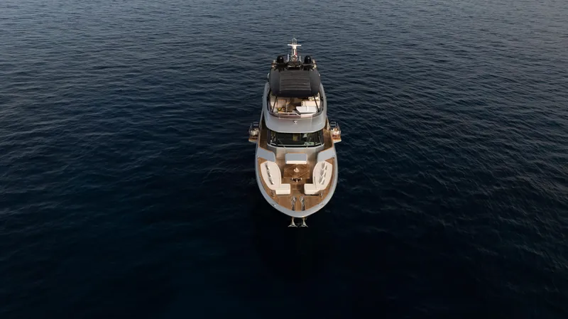 Venus Yacht Photos Pics Aerial view of 2013 Monte Carlo Yachts 86'7'' luxury yacht on open water.