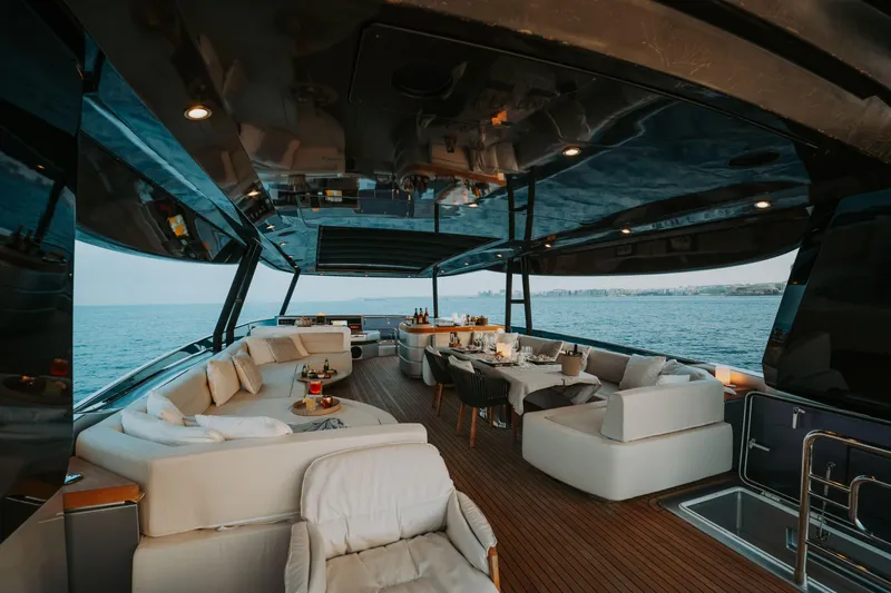 Venus Yacht Photos Pics Luxurious 2013 Monte Carlo Yachts 86'7'' with elegant outdoor seating and dining area.