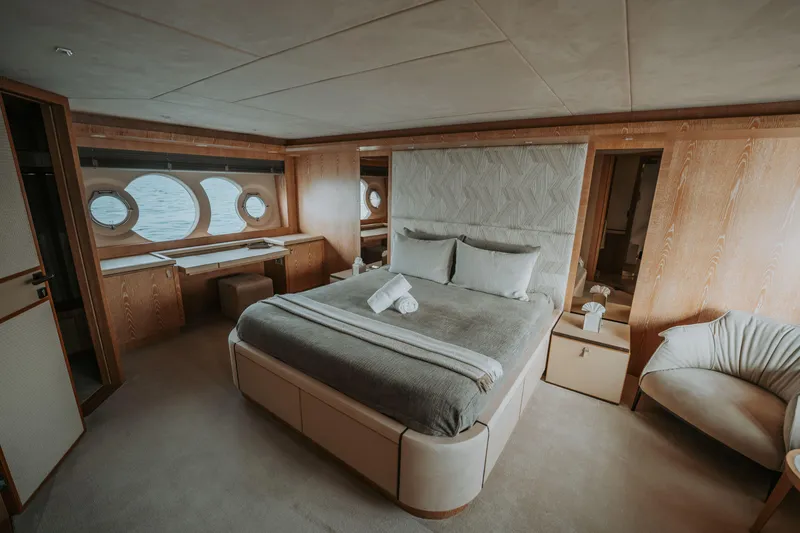Venus Yacht Photos Pics Luxurious bedroom interior on 2013 Monte Carlo Yachts 86'7'' with elegant wood finishes.