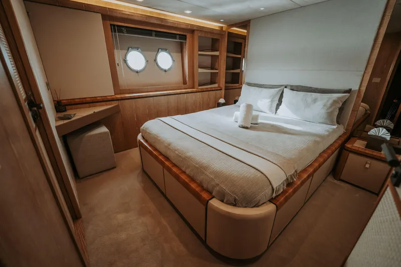 Venus Yacht Photos Pics Luxurious bedroom interior on 2013 Monte Carlo Yachts 86'7'' model, featuring elegant design.