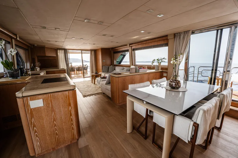 Venus Yacht Photos Pics Luxurious interior of 2013 Monte Carlo Yachts 86'7'', featuring elegant dining and living areas.
