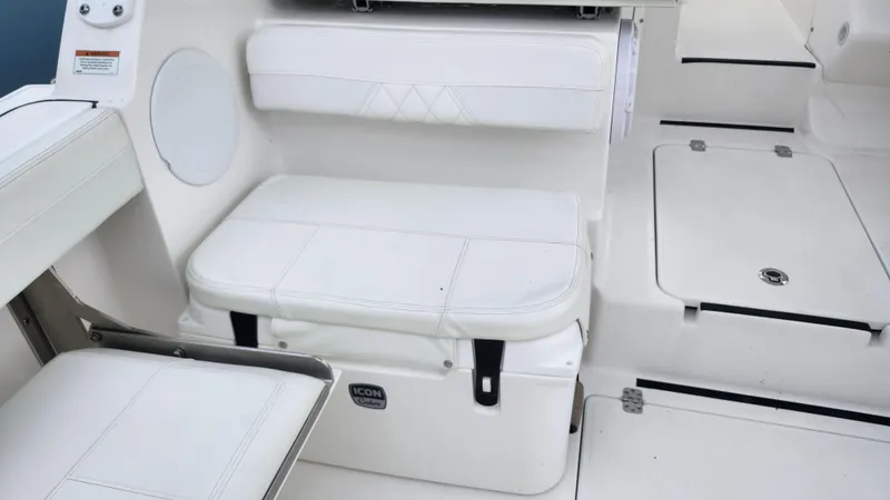  Yacht Photos Pics Edgewater 280 CX 2023 boat interior with white seating and storage compartments.