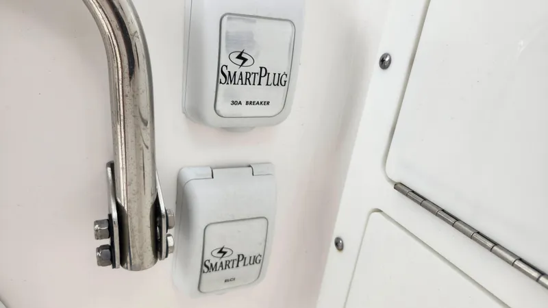  Yacht Photos Pics SmartPlug outlets on 2023 Edgewater 280 CX boat, featuring stainless steel handle.