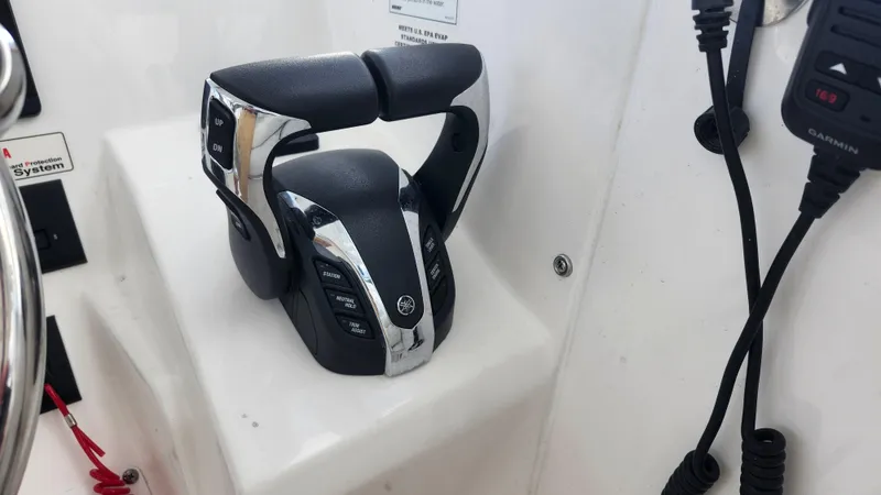  Yacht Photos Pics Edgewater 280 CX 2023 boat throttle controls and communication equipment.