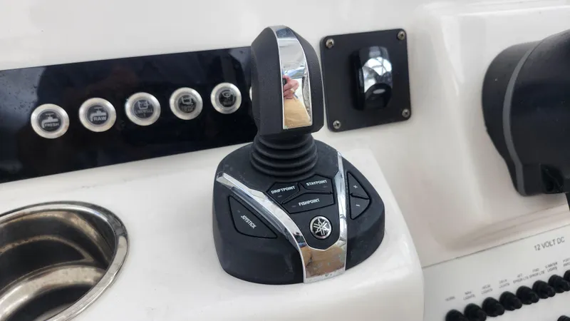  Yacht Photos Pics Edgewater 280 CX 2023 boat control panel with joystick and buttons.