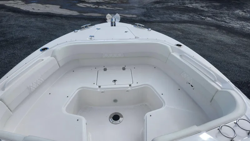  Yacht Photos Pics 2023 Edgewater 280 CX boat interior with spacious seating and storage.