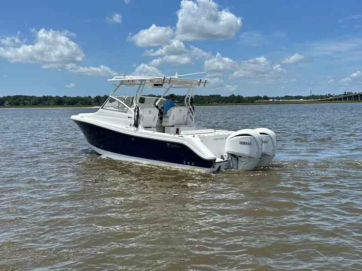  Yacht Photos Pics 2023 Edgewater 280 CX boat cruising on a sunny day with Yamaha engines.