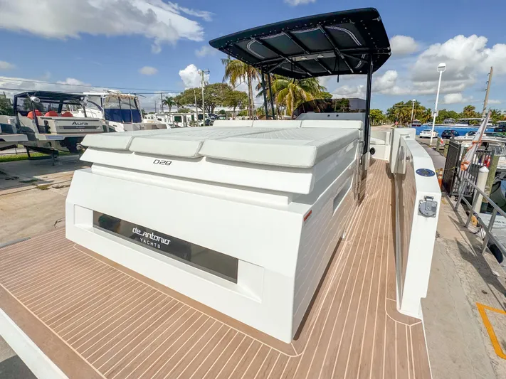  Yacht Photos Pics 2024 De Antonio Yachts D28 Open, docked, showcasing sleek design and spacious deck.