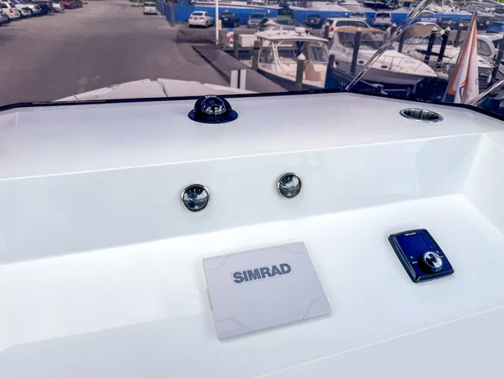  Yacht Photos Pics 2024 De Antonio Yachts D28 Open dashboard with Simrad navigation system and compass.
