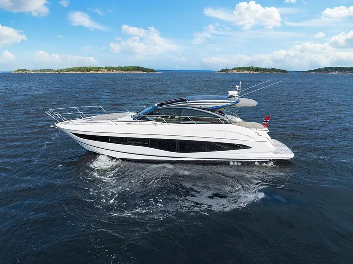 V50330 Yacht Photos Pics 2024 Princess V50 Open yacht cruising on open sea under clear blue sky.