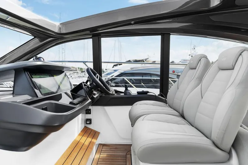 V50330 Yacht Photos Pics 2024 Princess V50 Open yacht interior with luxurious seating and modern dashboard.