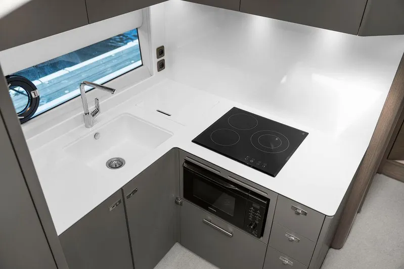 V50330 Yacht Photos Pics Modern kitchen in 2024 Princess V50 Open yacht with sleek design and appliances.