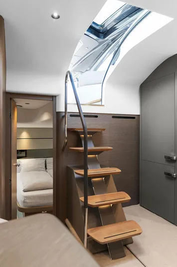 V50330 Yacht Photos Pics Interior of 2024 Princess V50 Open yacht with modern staircase and skylight.