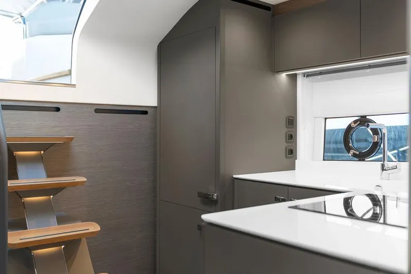 V50330 Yacht Photos Pics Modern interior of 2024 Princess V50 Open yacht with sleek kitchen and stylish staircase.