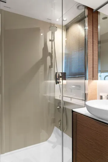 V50330 Yacht Photos Pics Modern bathroom in 2024 Princess V50 Open yacht with glass shower and sleek design.