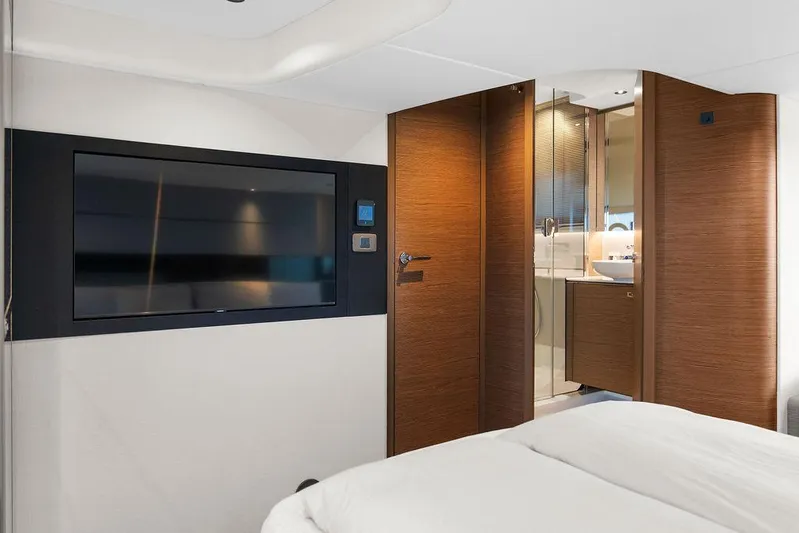V50330 Yacht Photos Pics Luxurious interior of 2024 Princess V50 Open yacht with TV and ensuite bathroom.